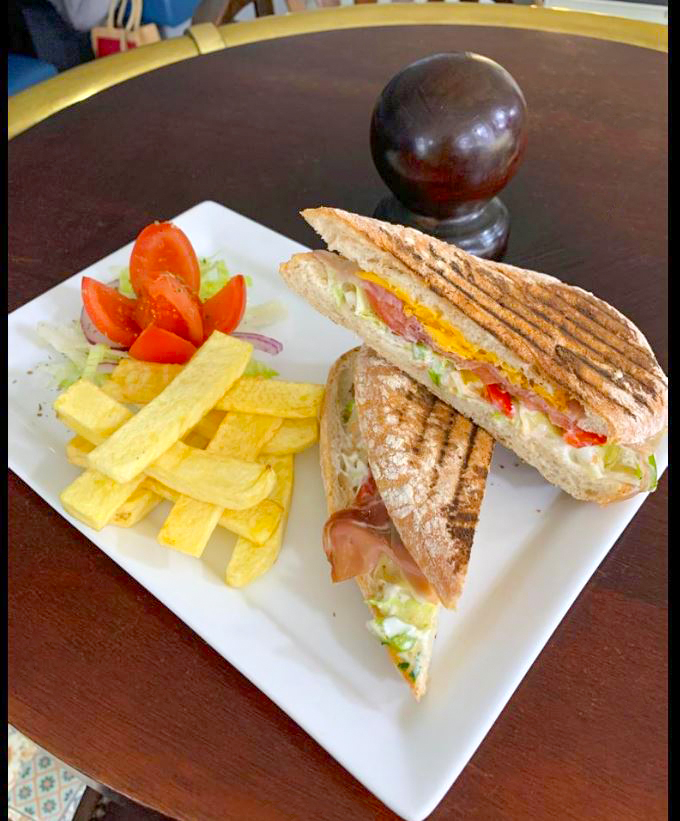 paninis with fries and tomato in a plate served at The Village Fish Bar Neilston